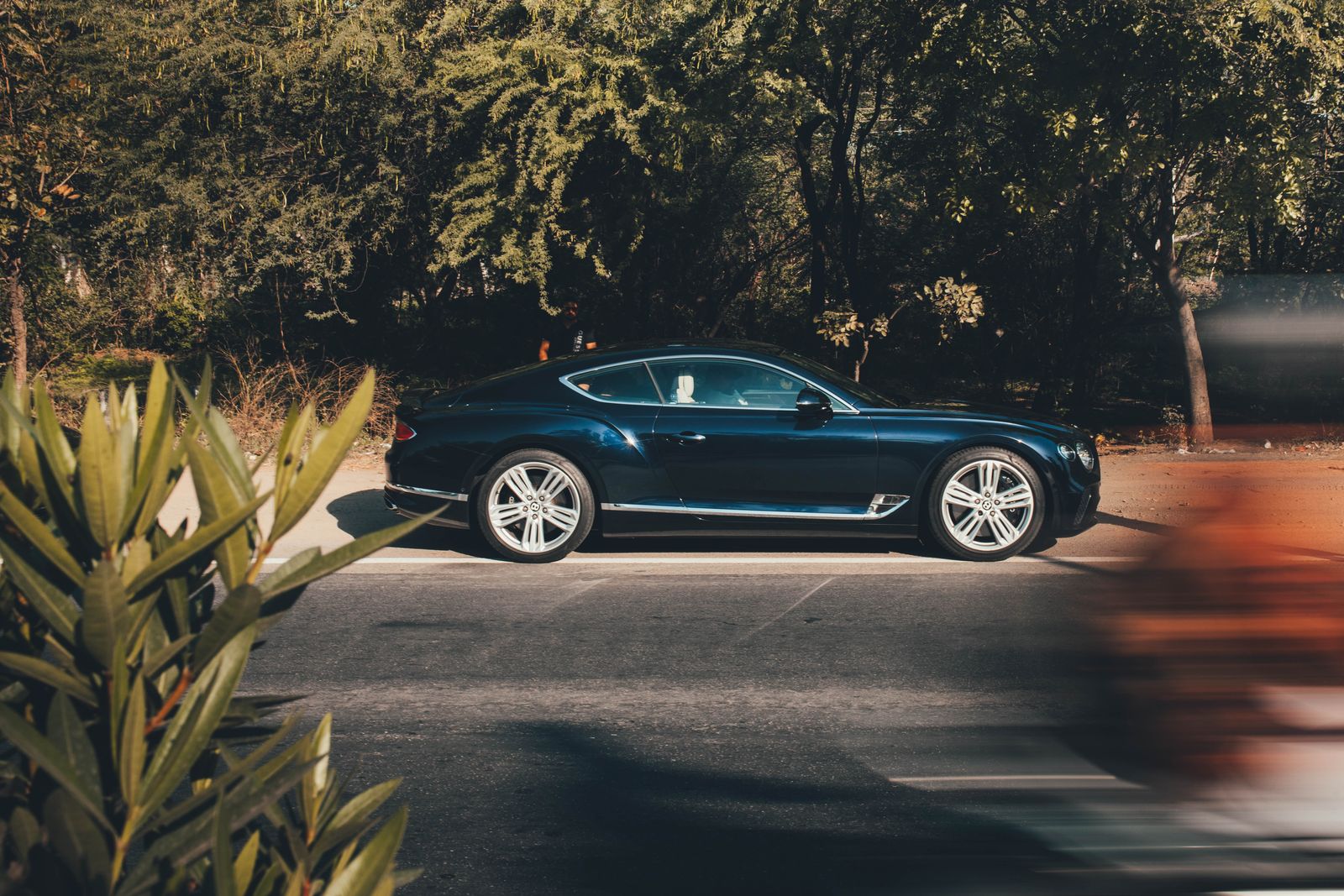 Bentley Continental GT parked on a shaded street