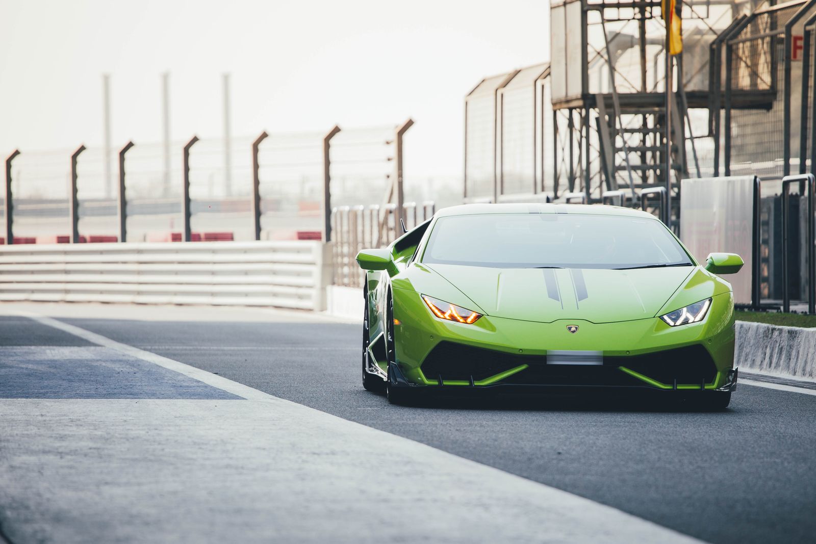 Green Lamborghini Huracan on a race track