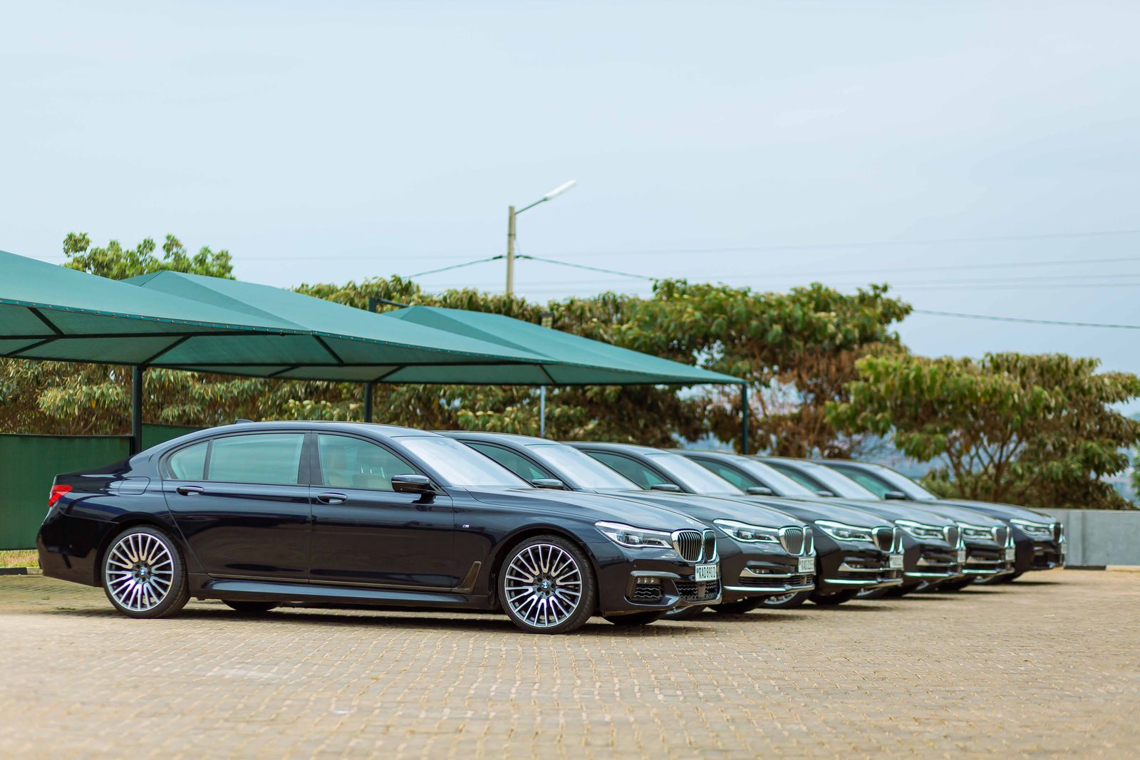 Lineup of luxury BMW Series 7 cars parked outdoors