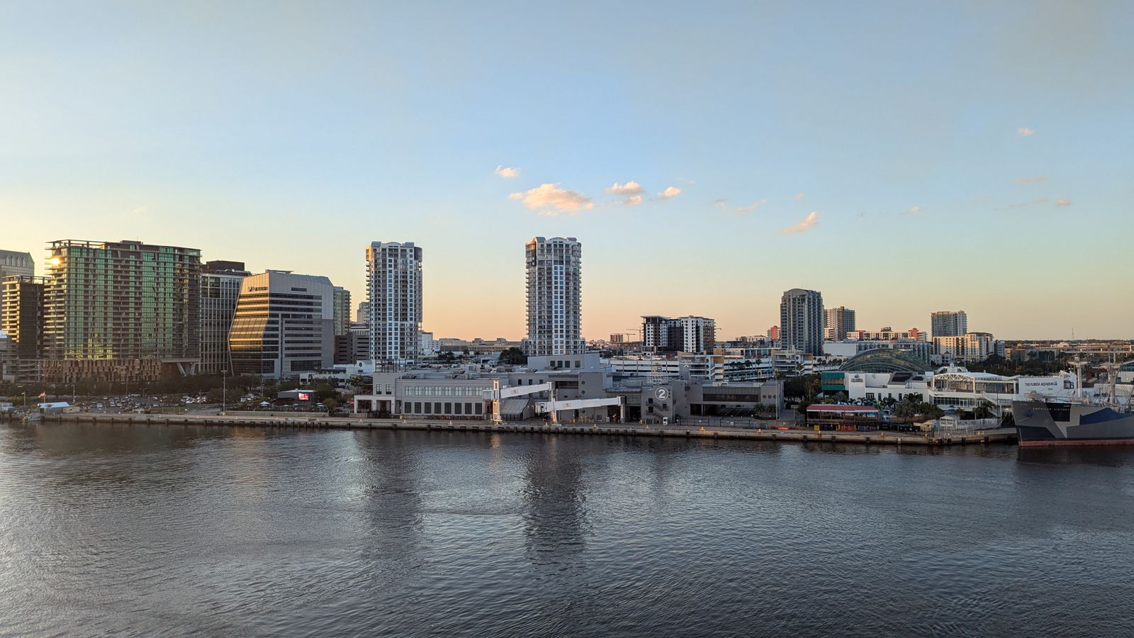 Tampa Bay skyline at dusk reflecting on calm waters